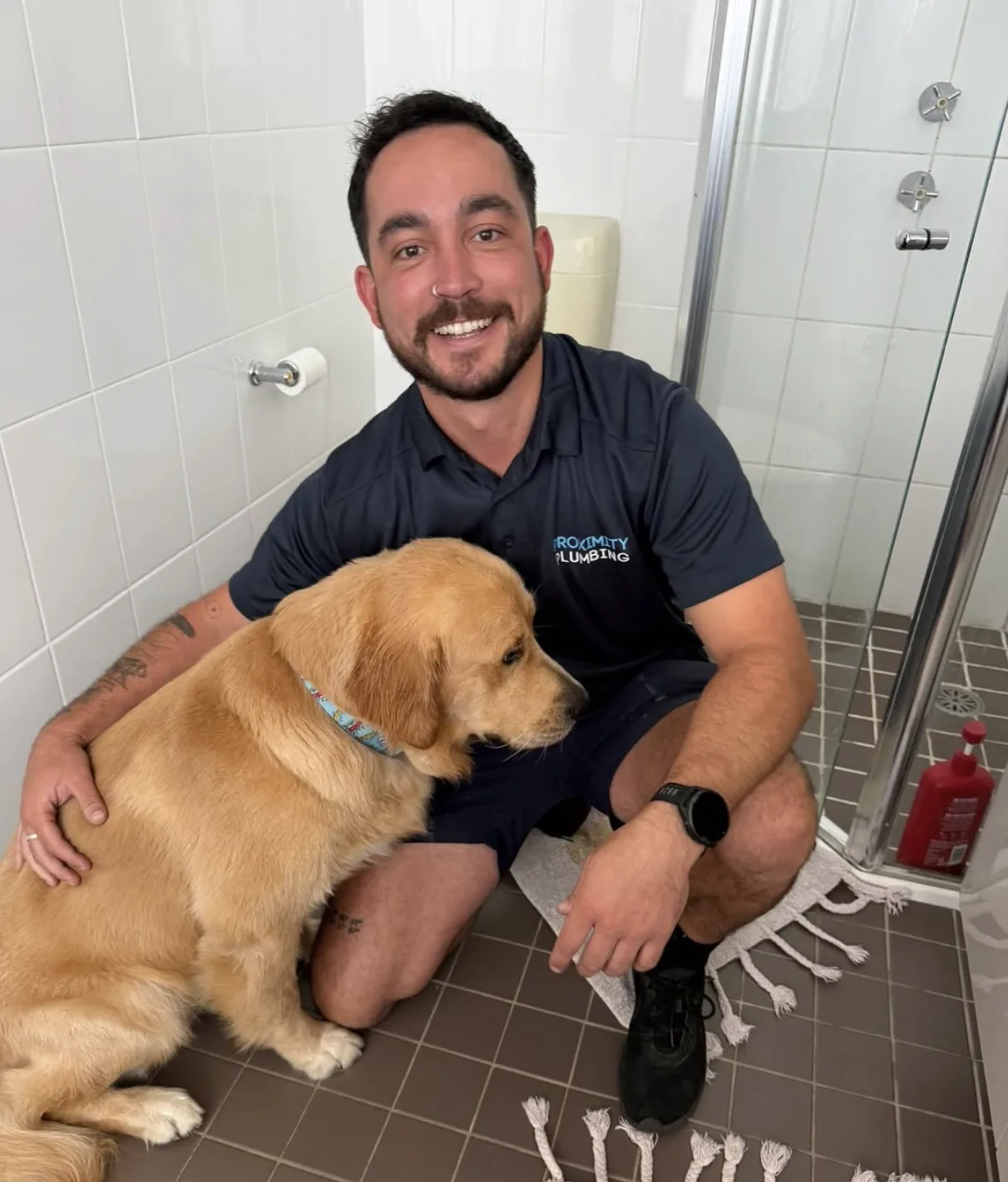 A plumber working on a bathroom call-out