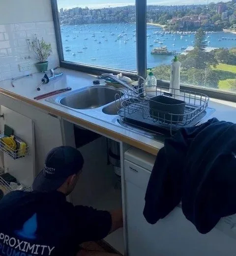Repairing pipework under a kitchen sink